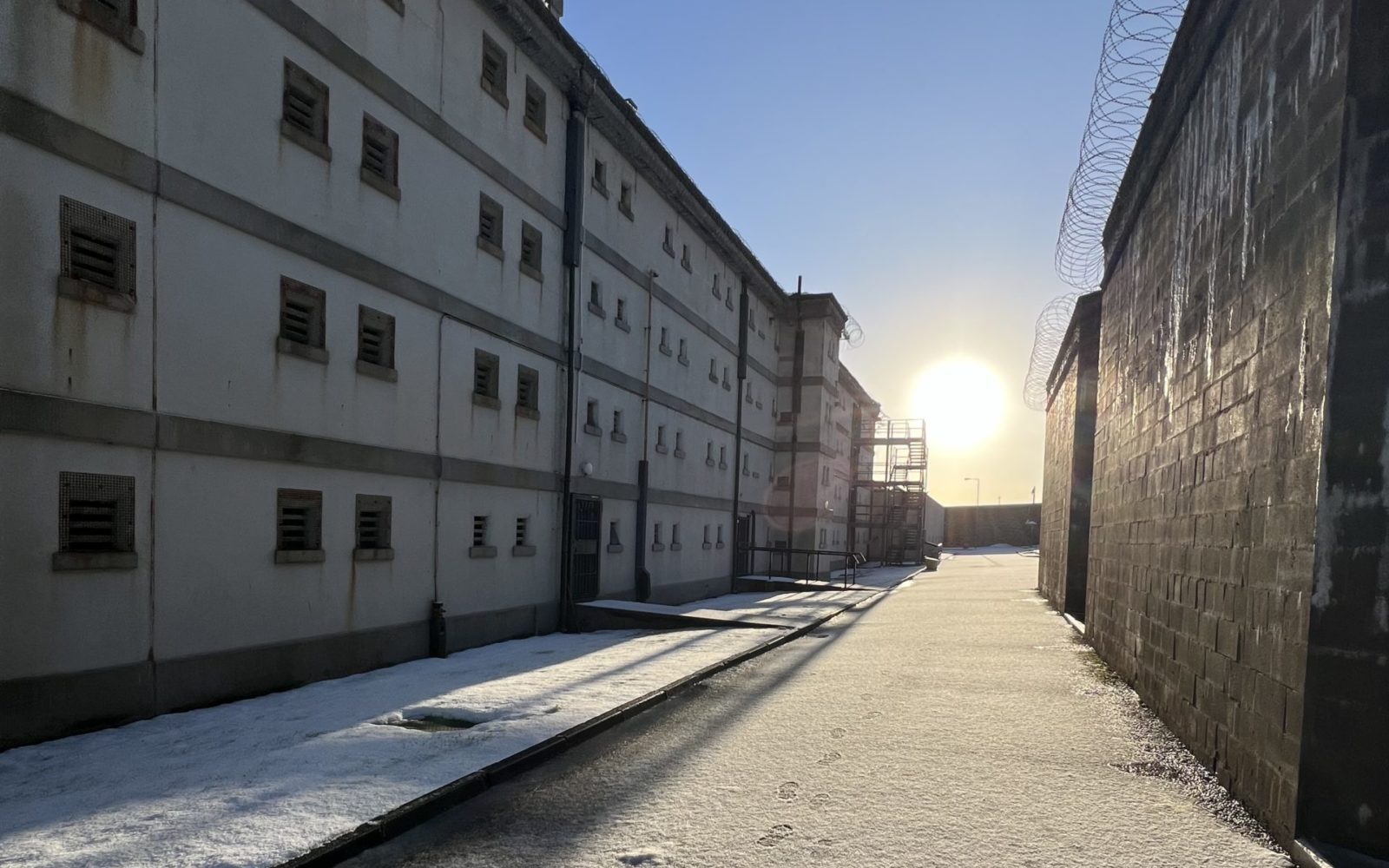 The exterior of Peterhead Prison. There is light snow on the floor.