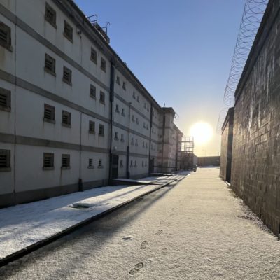 The exterior of Peterhead Prison. There is light snow on the floor.